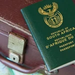 A-South-African-passport-on-top-of-a-vintage-travel-bag.-Travel-or-immigration-concept-image.-1536x864.webp